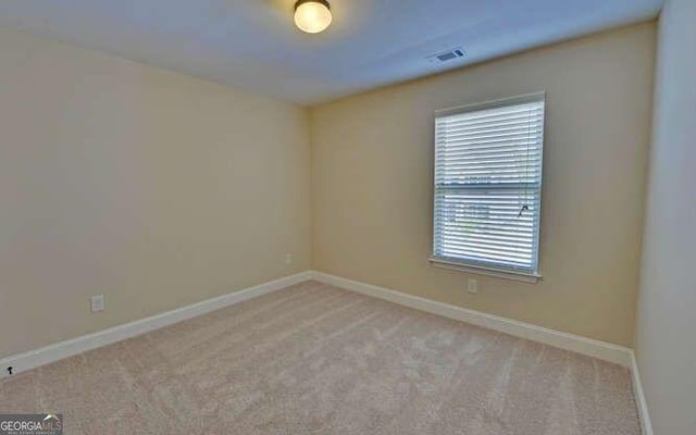 view of carpeted spare room