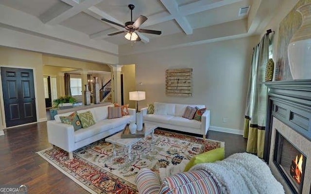 living room featuring beamed ceiling, ceiling fan, coffered ceiling, and dark hardwood / wood-style floors