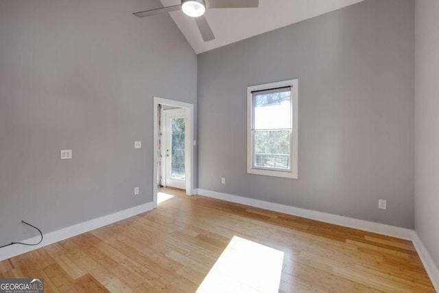 unfurnished room featuring ceiling fan, lofted ceiling, and light hardwood / wood-style floors