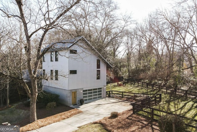 view of side of property featuring a garage