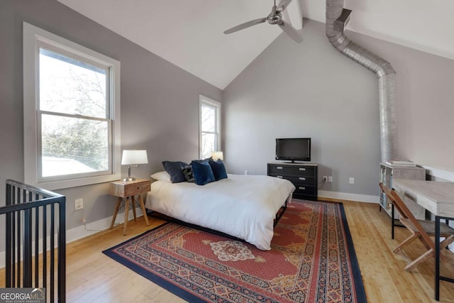 bedroom featuring vaulted ceiling with beams, wood-type flooring, and ceiling fan