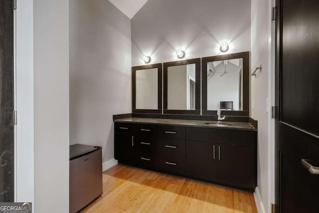 bathroom with vanity and hardwood / wood-style floors