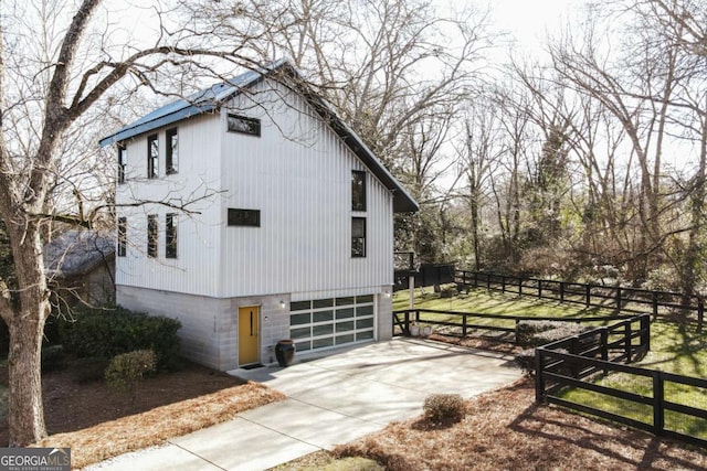 view of property exterior with a garage