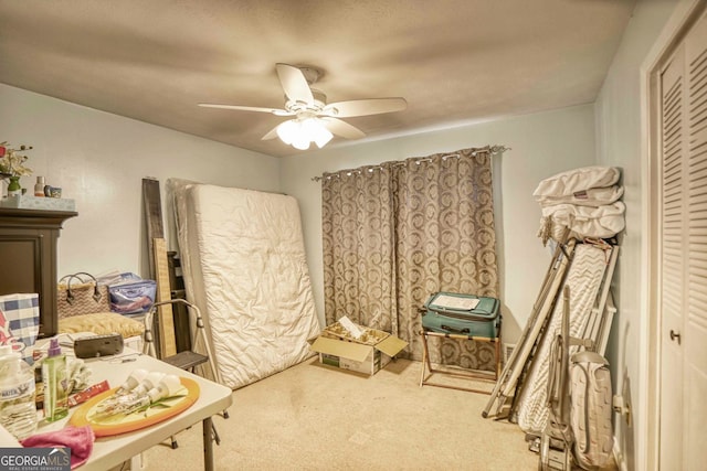 bedroom featuring ceiling fan, carpet flooring, and a closet