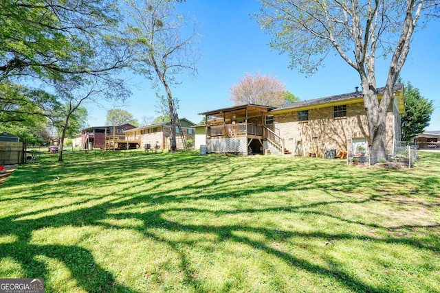 view of yard with a wooden deck