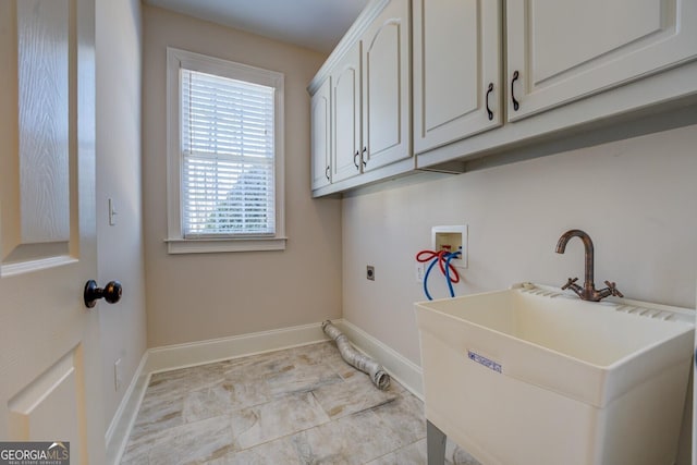 laundry room featuring cabinets, sink, hookup for a washing machine, and electric dryer hookup