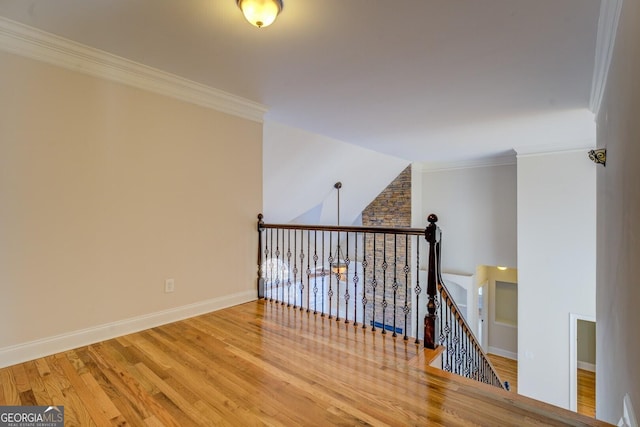 interior space featuring ornamental molding and light hardwood / wood-style flooring