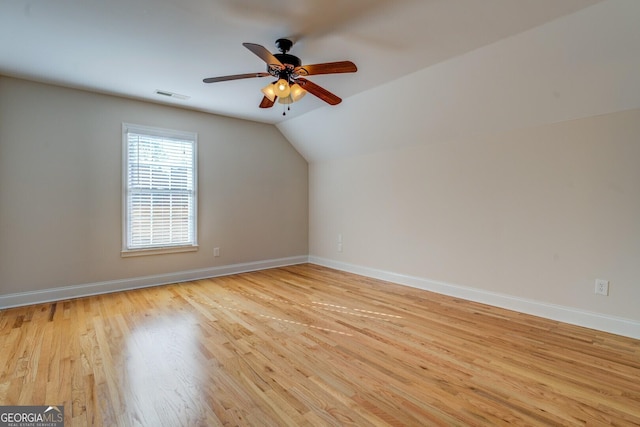 bonus room with light hardwood / wood-style flooring, vaulted ceiling, and ceiling fan