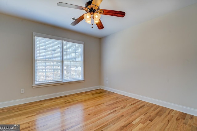 empty room with light hardwood / wood-style flooring and ceiling fan