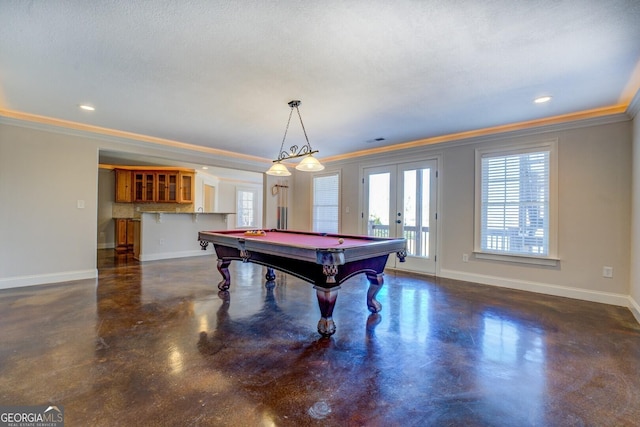 playroom featuring ornamental molding, indoor bar, billiards, and french doors