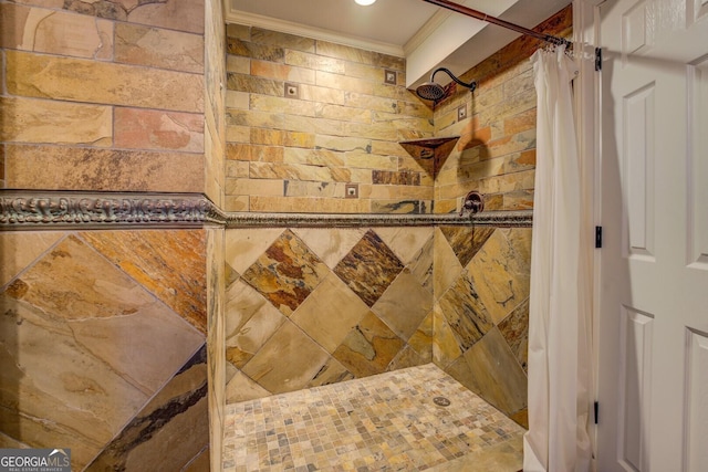 bathroom with ornamental molding and curtained shower