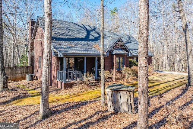 view of front of house with covered porch and central air condition unit