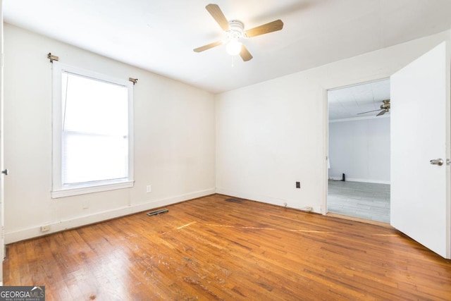 unfurnished bedroom featuring hardwood / wood-style flooring and ceiling fan