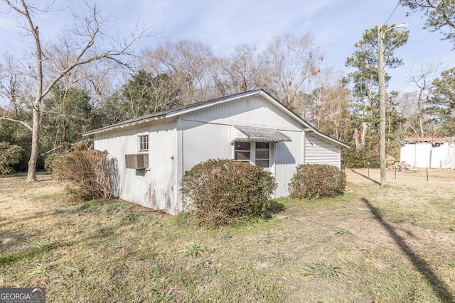 view of property exterior featuring a yard