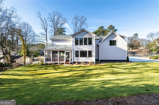 back of house featuring a yard