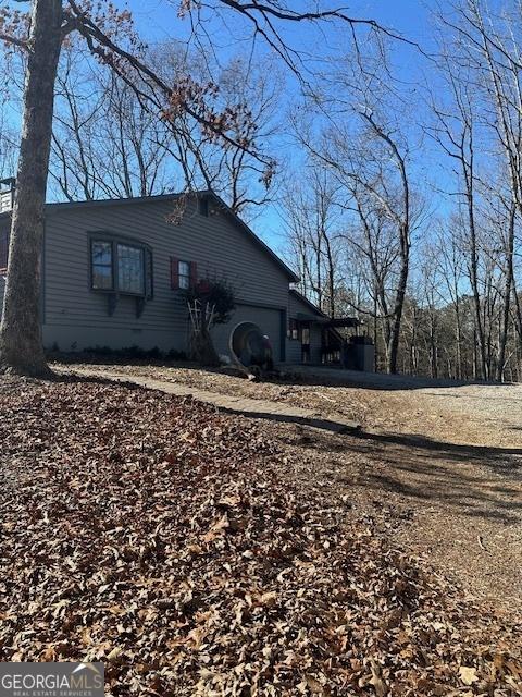 view of property exterior featuring a garage