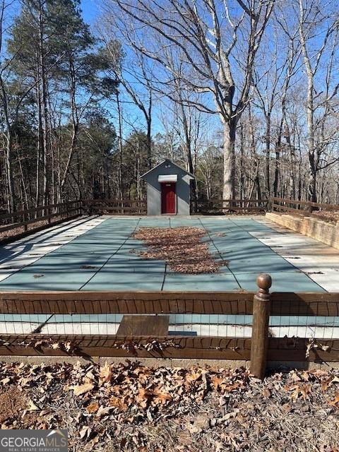 view of pool featuring a storage shed