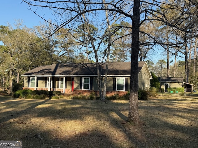 128 Byron Plantation Rd, Albany, GA 31721 - ranch-style house with covered porch