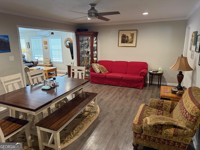 living room with hardwood / wood-style floors, crown molding, a wall mounted AC, and ceiling fan