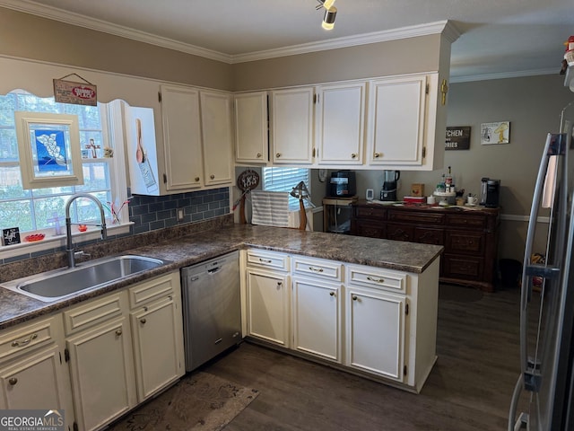 128 Byron Plantation Rd, Albany, GA 31721 - kitchen featuring dark wood finished floors, a peninsula, a sink, dishwasher, and crown molding