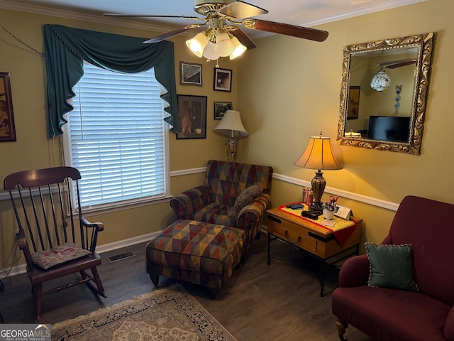 sitting room featuring ceiling fan, ornamental molding, and hardwood / wood-style floors