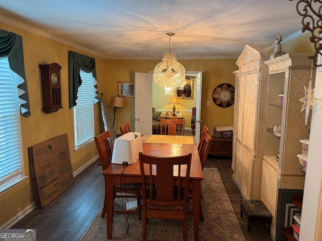 128 Byron Plantation Rd, Albany, GA 31721 - dining room featuring dark wood-style floors, a notable chandelier, baseboards, and ornamental molding