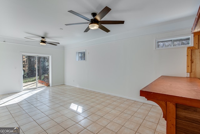 tiled spare room featuring crown molding and ceiling fan