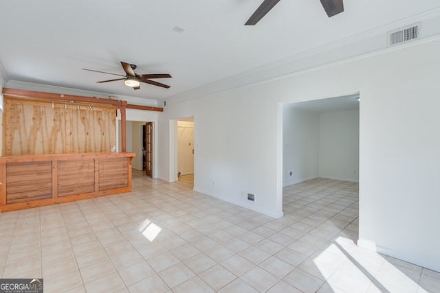 spare room featuring crown molding and ceiling fan