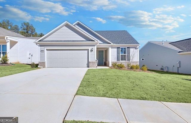 view of front of house featuring a garage and a front yard