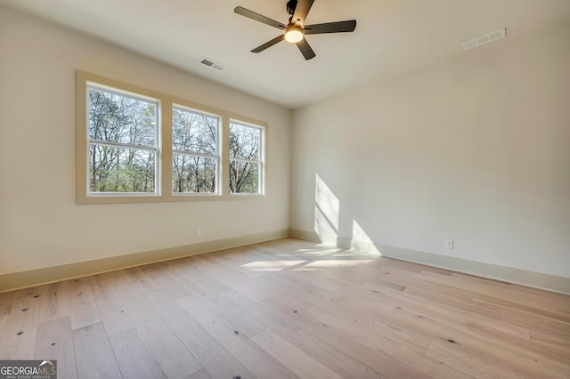 unfurnished room with ceiling fan and light wood-type flooring