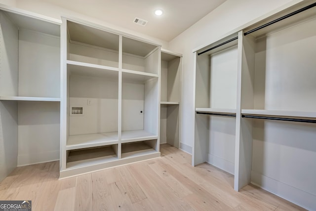 walk in closet featuring light hardwood / wood-style floors