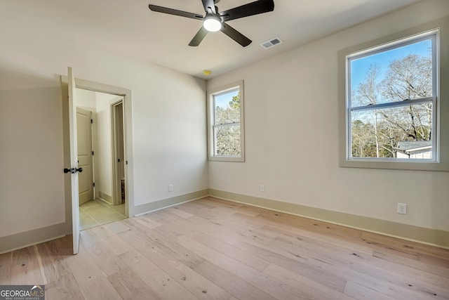 unfurnished bedroom with ceiling fan and light hardwood / wood-style floors