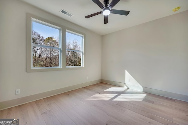 unfurnished room featuring ceiling fan and light hardwood / wood-style flooring