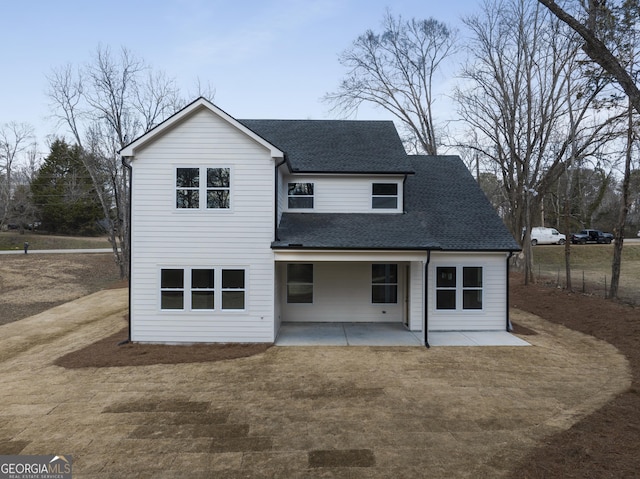 back of house with a patio