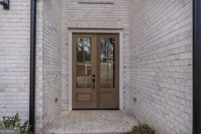 entrance to property featuring french doors