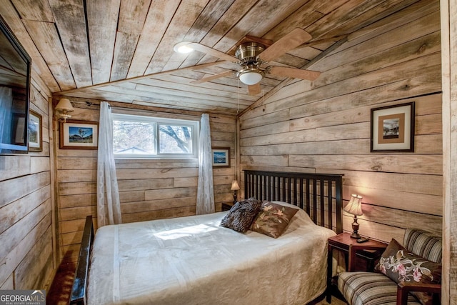 bedroom featuring lofted ceiling, wood ceiling, ceiling fan, and wood walls