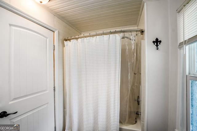 bathroom with shower / bathtub combination with curtain