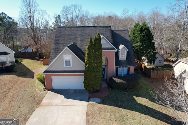 front facade featuring a garage and a front lawn