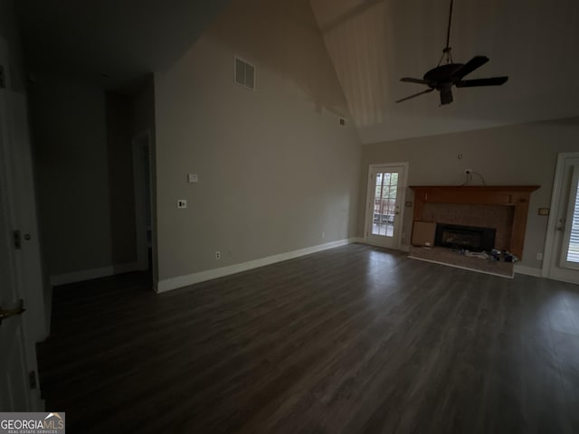 unfurnished living room with dark wood-type flooring, ceiling fan, and high vaulted ceiling