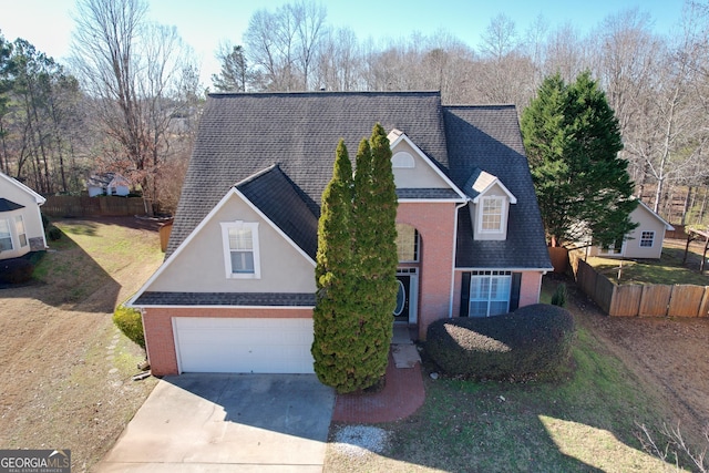 view of front property with a garage and a front yard