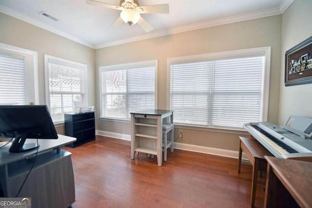 office space with ornamental molding, dark wood-type flooring, and ceiling fan