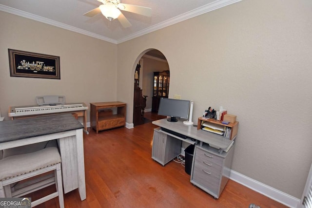 home office featuring crown molding, dark hardwood / wood-style floors, and ceiling fan