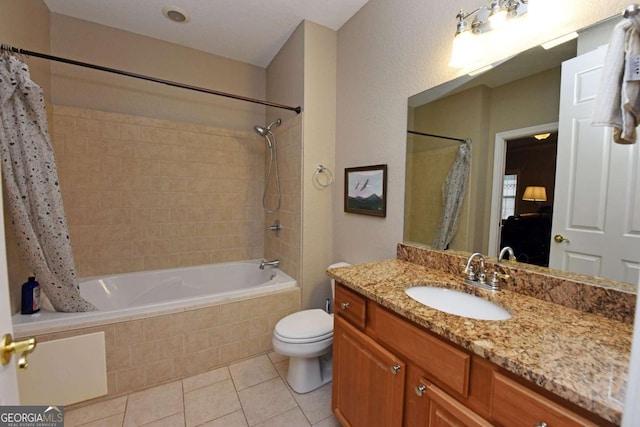 full bathroom with shower / tub combo with curtain, vanity, toilet, and tile patterned flooring