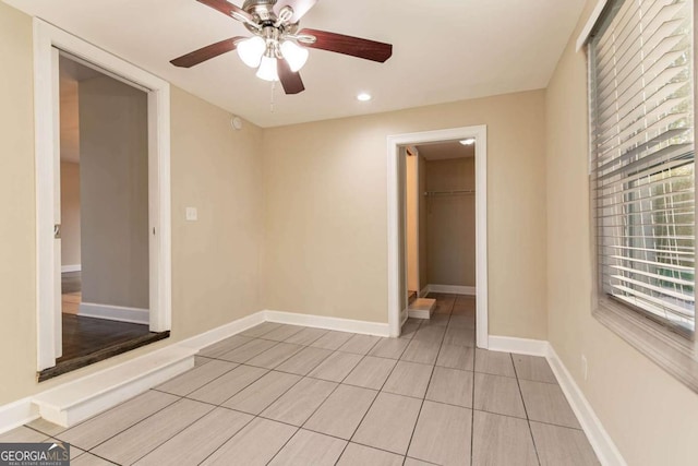 unfurnished room featuring ceiling fan