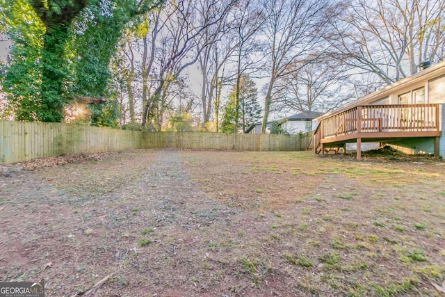 view of yard with a wooden deck