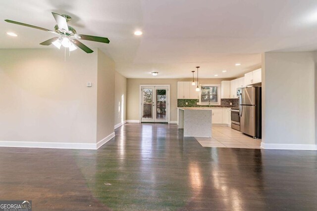 unfurnished living room with light hardwood / wood-style flooring