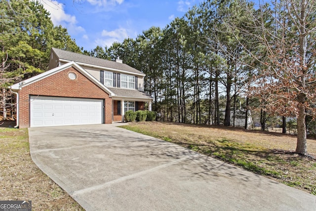 view of front of home with a garage and a front lawn