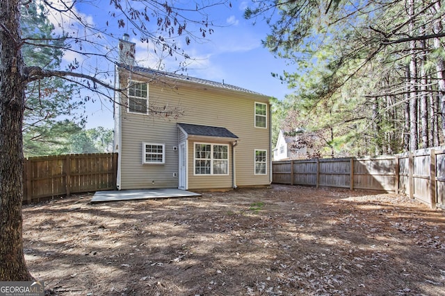 rear view of house with a patio