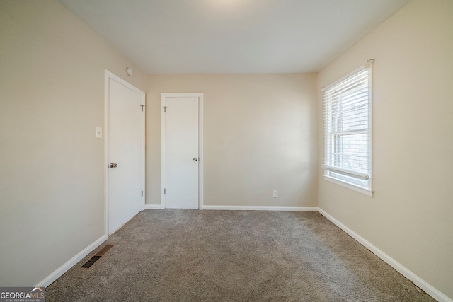 empty room featuring carpet floors