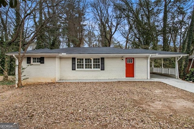 single story home featuring a carport